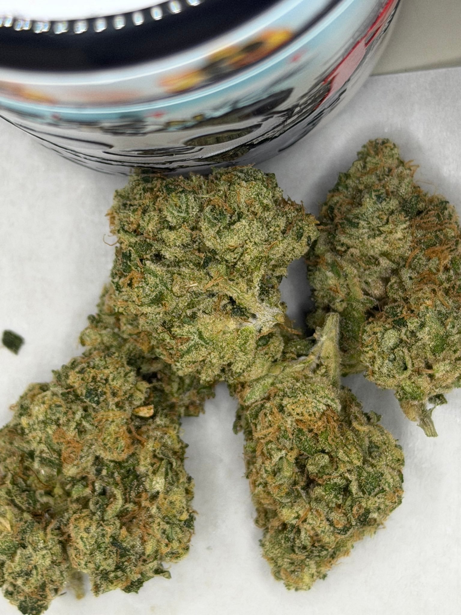 PIZEN #9 by THE TENCO premium cannabis buds close up with dense frosty trichomes and bright orange pistils