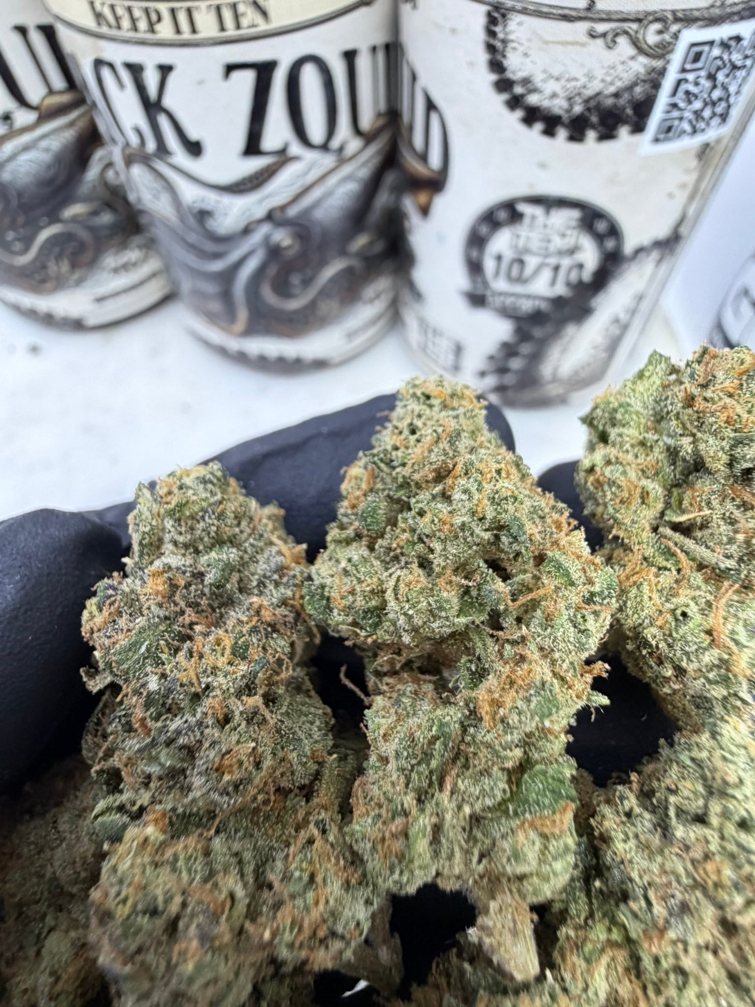Close-up of Black Squid by THE TENCO Black Zquid buds highlighting trichome density and hybrid structure