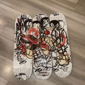 Zushi x Slawn Skateboard by THE TENCO featuring Black Zushi graffiti art