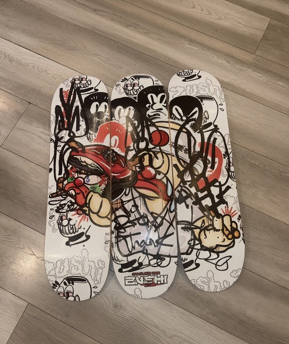 Zushi x Slawn Skateboard by THE TENCO featuring Black Zushi graffiti art