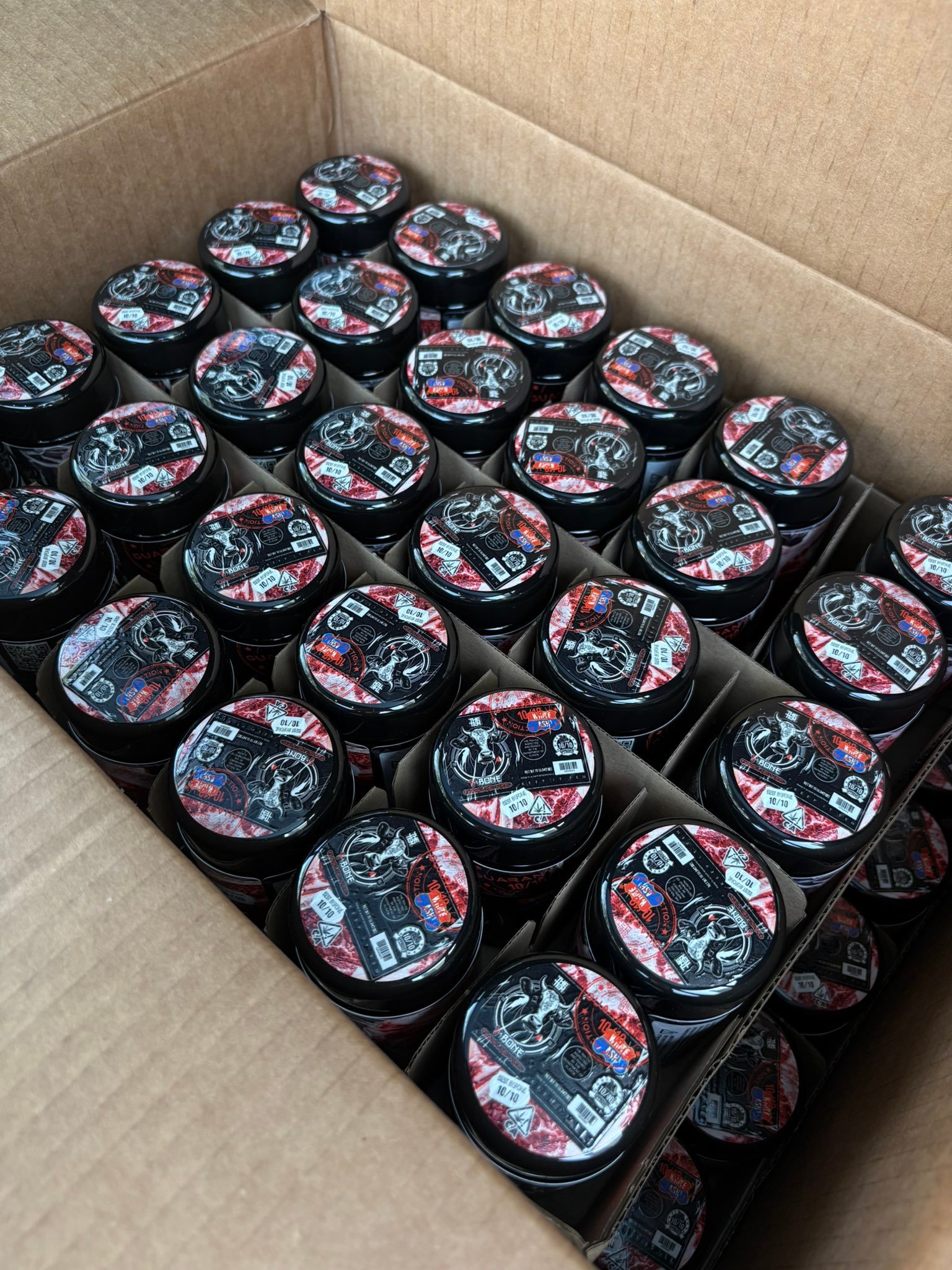 Collection of T-BONE by THE TENCO cannabis jars in premium packaging ready for discreet shipping